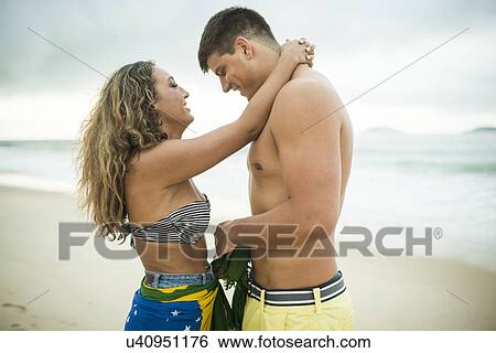 Stock Photograph - Romantic young couple, Ipanema Beach, Rio de Janeiro, Brazil. Fotosearch