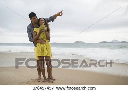 Stock Photo - Romantic young couple on Ipanema Beach, Rio de Janeiro, Brazil. Fotosearch