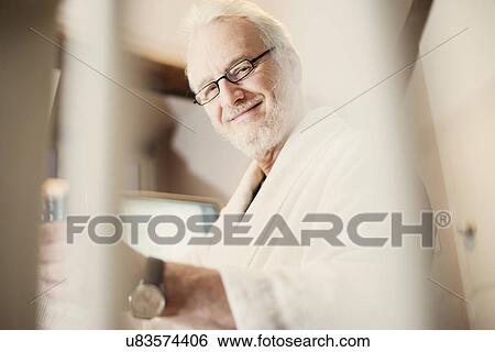 Senior man wearing glasses, portrait View Large Photo Image Stock Photograph - Senior man wearing glasses, portrait. Fotosearch