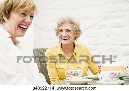 Senior woman and daughter having tea View Large Photo Image Picture - Senior woman and daughter having tea. Fotosearch