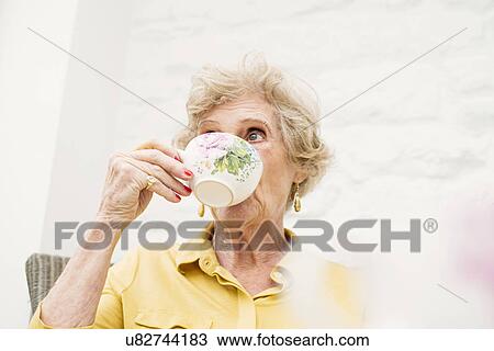 Senior woman drinking tea View Large Photo Image Stock Image - Senior woman drinking tea. Fotosearch