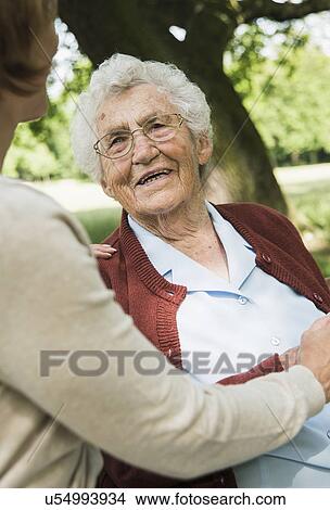 Senior woman looking at granddaughter View Large Photo Image Picture - Senior woman looking at granddaughter. Fotosearch