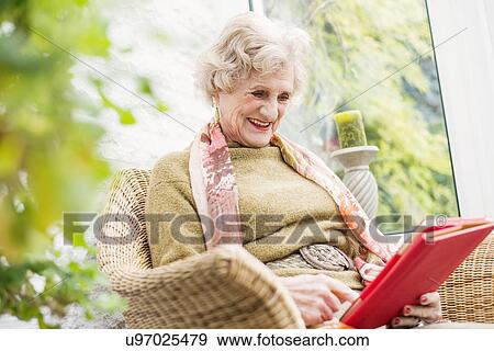 Senior woman using digital tablet View Large Photo Image Stock Photo - Senior woman using digital tablet. Fotosearch