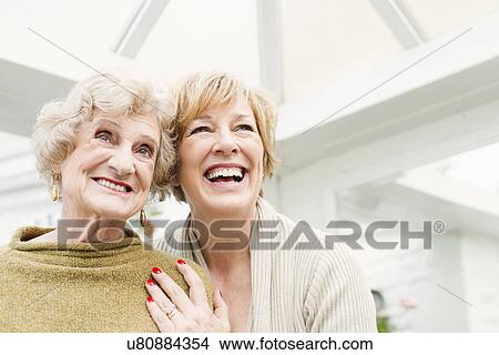 Senior woman with daughter, laughing View Large Photo Image Picture - Senior woman with daughter, laughing. Fotosearch
