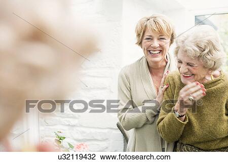 Senior woman with daughter, laughing View Large Photo Image Stock Image - Senior woman with daughter, laughing. Fotosearch