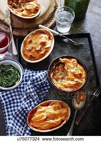 Shepherds pie, kumara, spinach, red wine and water View Large Photo Image Picture - Shepherds pie, kumara, spinach, red wine and water. Fotosearch
