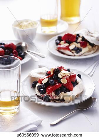 Stock Photo - Still life of almond and beery pavlovas. Fotosearch
