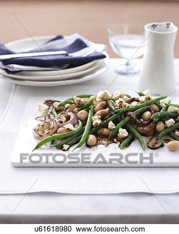 Stock Image - Still life of bean, onion and feta salad. Fotosearch