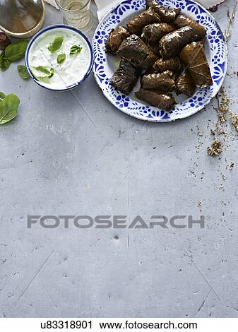 Still life of dolmade with yogurt dipping sauce View Large Photo Image Stock Image - Still life of dolmade with yogurt dipping sauce. Fotosearch