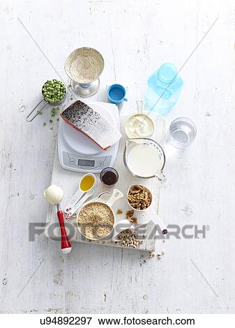 Still life of food measuring choices with kitchen scales View Large Photo Image Stock Photo - Still life of food measuring choices with kitchen scales. Fotosearch