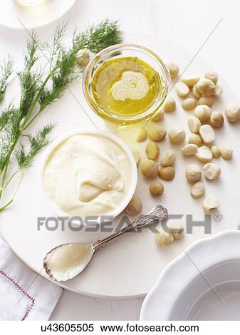 Still life of macadamia oil, mayonnaise with macadamia nuts View Large Photo Image Stock Photography - Still life of macadamia oil, mayonnaise with macadamia nuts. Fotosearch