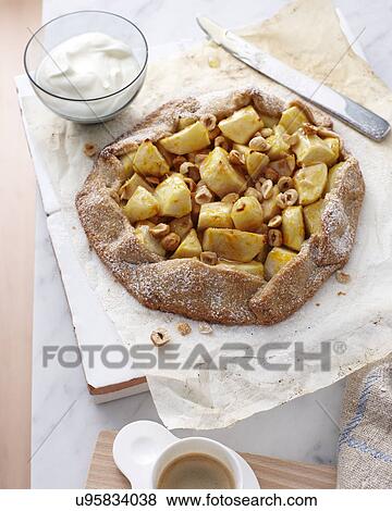 Still life of pear and hazelnut crostata View Large Photo Image Stock Photo - Still life of pear and hazelnut crostata. Fotosearch