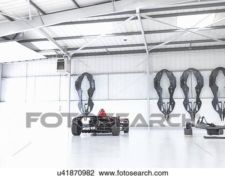 Stock Image - Supercar in sports car factory. Fotosearch
