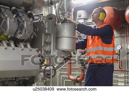 Stock Photo - Technician making a check in power station. Fotosearch