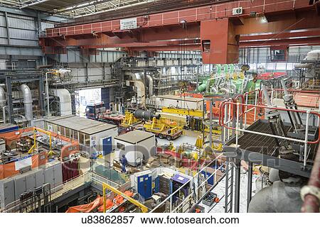 Turbine hall in repair during power station outage, high angle view View Large Photo Image Stock Photo - Turbine hall in repair during power station outage, high angle view. Fotosearch