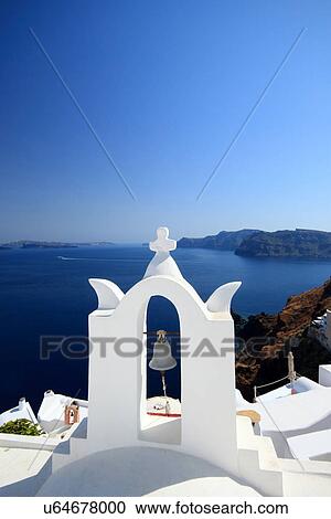 Stock Image - View of bell towers, Oia, Santorini, Cyclades Islands, Greece. Fotosearch