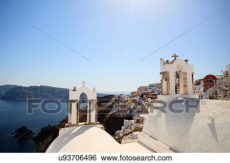 View of Oia town and bell towers, Santorini, Cyclades Islands, Greece View Large Photo Image Stock Photograph - View of Oia town and bell towers, Santorini, Cyclades Islands, Greece. Fotosearch