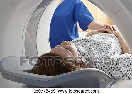 Stock Photo - Woman in CT scanner. Fotosearch