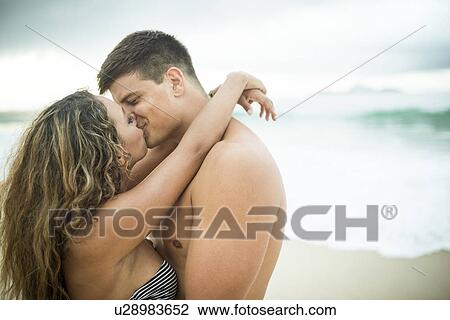 Young couple kissing, Ipanema Beach, Rio de Janeiro, Brazil View Large Photo Image Stock Image - Young couple kissing, Ipanema Beach, Rio de Janeiro, Brazil. Fotosearch