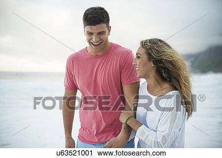 Stock Image - Young couple on Ipanema Beach, Rio de Janeiro, Brazil. Fotosearch