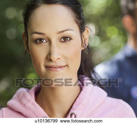 Young woman in pink hoodie View Large Photo Image Stock Photo - Young woman in pink hoodie. Fotosearch