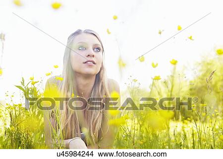 Picture - Young woman with long blonde hair, portrait. Fotosearch
