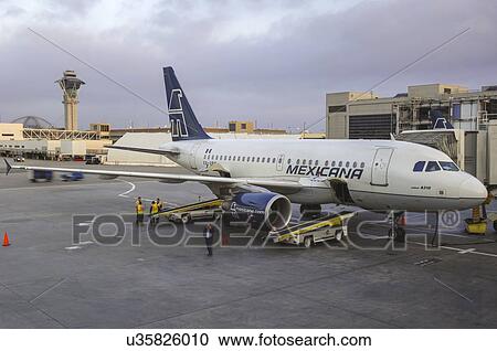 Airbus A318 of Mexicana at the gate at Los Angeles International Airport View Large Photo Image Stock Image - Airbus A318 of Mexicana at the gate at Los Angeles International Airport. Fotosearch