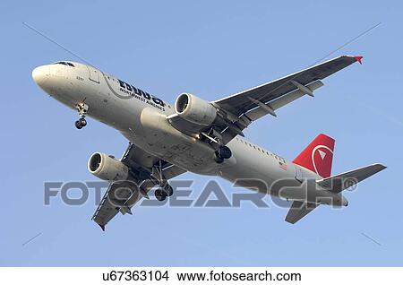 Picture - Airbus A320 of Northwest Airlines landing at Los Angeles International Airport. Fotosearch