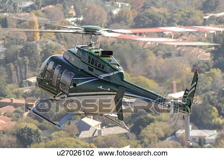 Bell 407 helicopter over Johannesburg, South Africa View Large Photo Image Stock Image - Bell 407 helicopter over Johannesburg, South Africa. Fotosearch