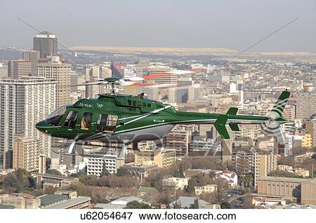 Bell 407 helicopter over Johannesburg View Large Photo Image Stock Photo - Bell 407 helicopter over Johannesburg. Fotosearch