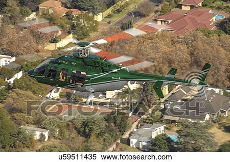 Bell 407 helicopter over Johannesburg View Large Photo Image Stock Photography - Bell 407 helicopter over Johannesburg. Fotosearch