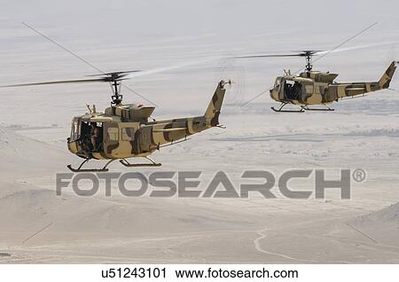 Stock Image - Bell Huey II in flight near Kabul. Fotosearch