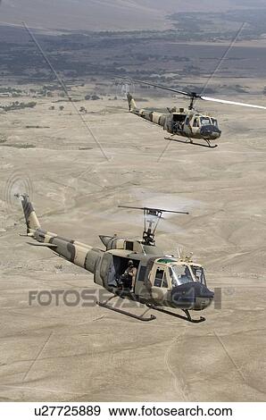 Stock Photo - Bell Huey II in flight near Kabul. Fotosearch