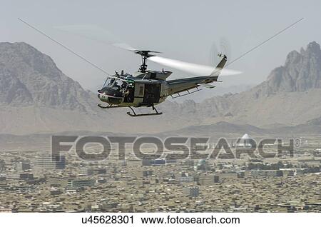 Bell Huey II in flight near Kandahar, Afghanistan View Large Photo Image Stock Image - Bell Huey II in flight near Kandahar, Afghanistan. Fotosearch