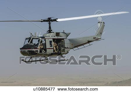 Stock Photo - Bell Huey II in flight near Kandahar, Afghanistan. Fotosearch