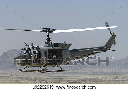 Stock Photo - Bell Huey II in flight near Kandahar, Afghanistan. Fotosearch