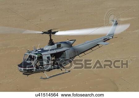 Bell Huey II in flight over the Registan Desert View Large Photo Image Picture - Bell Huey II in flight over the Registan Desert. Fotosearch