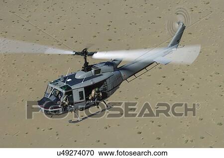 Bell Huey II in flight over the Registan Desert, Afghanistan View Large Photo Image Stock Image - Bell Huey II in flight over the Registan Desert, Afghanistan. Fotosearch