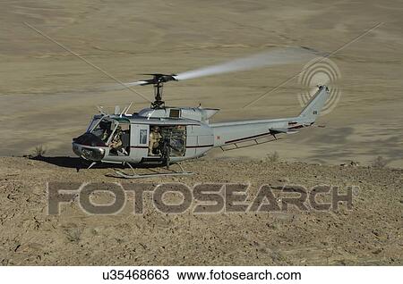 Bell Huey II on a mountain top near Kandahar View Large Photo Image Stock Image - Bell Huey II on a mountain top near Kandahar. Fotosearch