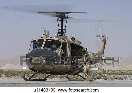 Bell Huey II on the ramp at Kandahar Airfield View Large Photo Image Stock Image - Bell Huey II on the ramp at Kandahar Airfield. Fotosearch