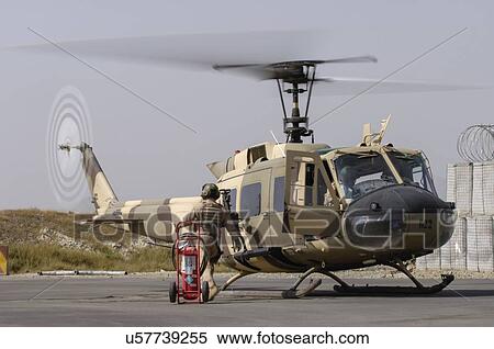Bell Huey II preparing for mission; Kabul, Afghanistan View Large Photo Image Stock Photography - Bell Huey II preparing for mission; Kabul, Afghanistan. Fotosearch
