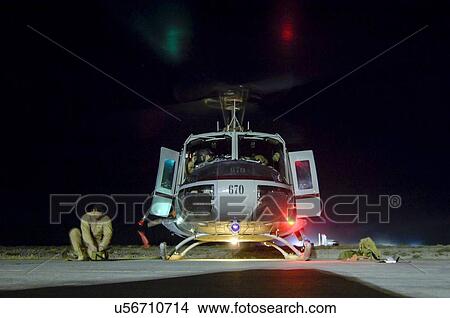 Bell Huey II preparing for night-time mission from Kandahar View Large Photo Image Picture - Bell Huey II preparing for night-time mission from Kandahar. Fotosearch