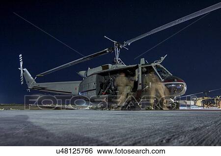 Bell Huey II preparing for night-time mission from Kandahar, Afghanistan View Large Photo Image Stock Photograph - Bell Huey II preparing for night-time mission from Kandahar, Afghanistan. Fotosearch