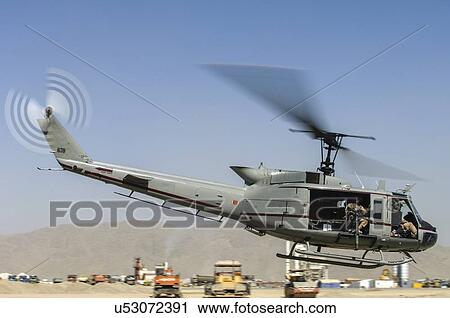 Stock Image - Bell Huey II taking off from Kandahar, Afghanistan. Fotosearch