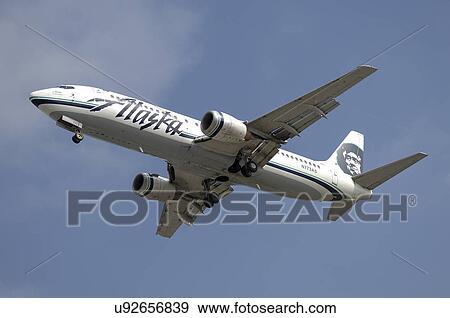 Stock Photo - Boeing 737-400 of Alaska Airlines on final approach for Los Angeles International Airport. Fotosearch