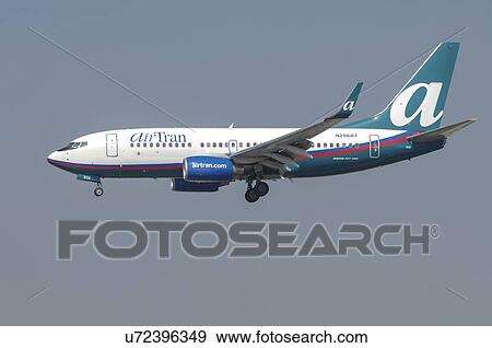 Stock Photo - Boeing 737-700 of Air Tran on final approach to Los Angeles International Airport. Fotosearch