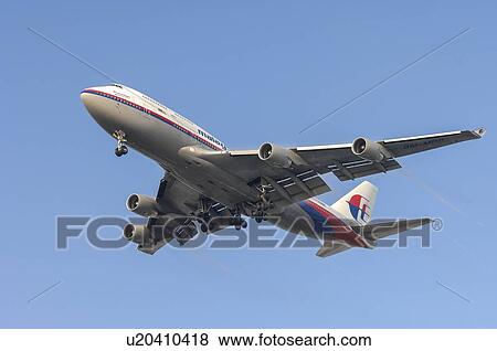 Stock Photo - Boeing 747-400 of Malaysian Airlines landing at Los Angeles International Airport. Fotosearch