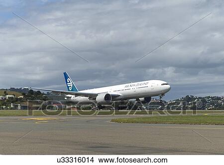 Picture - Boeing 777-300 of Air New Zealand taking off from Wellington Airport. Fotosearch