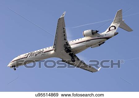 Stock Photo - Bombardier CRJ-701 of Horizon Airline landing at Los Angeles International Airport. Fotosearch