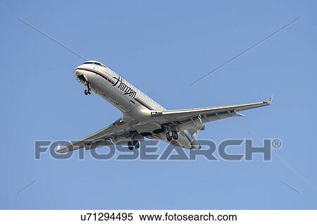 Stock Photography - Bombardier CRJ-701 of Horizon Airline landing . Fotosearch